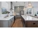 Modern kitchen with gray cabinets, quartz countertops, and stainless steel appliances at 425 Firefly Cir # 42, Alpharetta, GA 30009