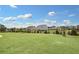 Expansive backyard with a view of community homes at 509 Elkwood Ln, Mcdonough, GA 30252