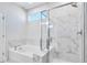 Bathroom with soaking tub and marble shower at 509 Elkwood Ln, Mcdonough, GA 30252