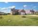 Two-story home with brick and siding exterior, two-car garage, and landscaped lawn at 509 Elkwood Ln, Mcdonough, GA 30252