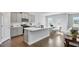 Modern kitchen with gray cabinets, white quartz countertops, and stainless steel appliances at 509 Elkwood Ln, Mcdonough, GA 30252