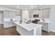 Bright kitchen boasts white quartz countertops, gray cabinets, and stainless steel appliances at 509 Elkwood Ln, Mcdonough, GA 30252