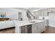 Modern kitchen with island, stainless steel appliances, and white quartz countertops at 509 Elkwood Ln, Mcdonough, GA 30252