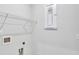 Bright laundry room with shelving and hookups at 509 Elkwood Ln, Mcdonough, GA 30252