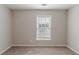 Simple bedroom with window and carpet at 7336 Toccoa Cir, Union City, GA 30291