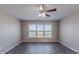 Simple bedroom with large window and ceiling fan at 7336 Toccoa Cir, Union City, GA 30291