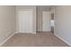 Bright bedroom with double door closet and access to hallway at 7336 Toccoa Cir, Union City, GA 30291