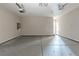 Spacious garage with light-grey flooring and an open door at 7336 Toccoa Cir, Union City, GA 30291