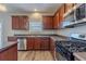 Kitchen with stainless steel appliances and granite countertops at 7336 Toccoa Cir, Union City, GA 30291