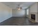 Living room with fireplace and ceiling fan at 7336 Toccoa Cir, Union City, GA 30291