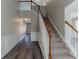 Elegant staircase with wooden railing and carpet at 7336 Toccoa Cir, Union City, GA 30291