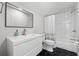 Modern bathroom with white vanity, hexagon floor tile and subway tile shower at 1043 Belmont Commons Dr, Smyrna, GA 30080