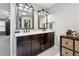 Double vanity bathroom with dark brown cabinets and white countertops at 1043 Belmont Commons Dr, Smyrna, GA 30080