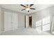 Bright bedroom with double doors to access hallway and additional closet space at 1043 Belmont Commons Dr, Smyrna, GA 30080