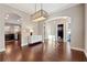 Bright dining room with hardwood floors and modern light fixture at 1043 Belmont Commons Dr, Smyrna, GA 30080