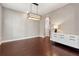 Hardwood floor dining room with chandelier and built-in hutch at 1043 Belmont Commons Dr, Smyrna, GA 30080