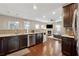 Modern kitchen with dark cabinets, granite counters, and stainless steel appliances at 1043 Belmont Commons Dr, Smyrna, GA 30080