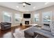 Living room with hardwood floors, fireplace, and comfy seating at 1043 Belmont Commons Dr, Smyrna, GA 30080