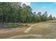 Large backyard with grassy area and treeline at 115 Oakdale Way, Temple, GA 30179