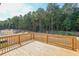 Wooden deck overlooking a wooded area at 115 Oakdale Way, Temple, GA 30179