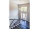 Two-story entryway with chandelier, dark hardwood floors, and staircase at 115 Oakdale Way, Temple, GA 30179