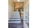 Modern entryway with stylish staircase and hardwood floors at 115 Oakdale Way, Temple, GA 30179