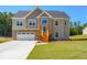 Two-story house with stone accents, wooden stairs, and a large yard at 115 Oakdale Way, Temple, GA 30179