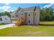 Two-story house with stone accents, wooden stairs, and a large yard at 115 Oakdale Way, Temple, GA 30179