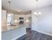 Kitchen boasts granite countertops and white cabinets at 115 Oakdale Way, Temple, GA 30179