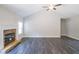 Living room with a stone fireplace and vaulted ceiling at 115 Oakdale Way, Temple, GA 30179