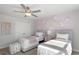 Twin bedroom with soft color scheme at 165 Delilah St, Mcdonough, GA 30252