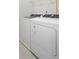 Convenient laundry room featuring a washer and dryer at 165 Delilah St, Mcdonough, GA 30252