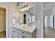 Modern bathroom with double vanity and large mirror at 175 Paris Dr, Lawrenceville, GA 30043