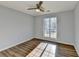 Bright bedroom with wood-look floors and large window at 175 Paris Dr, Lawrenceville, GA 30043