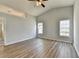 Large bedroom with hardwood floors and two windows at 175 Paris Dr, Lawrenceville, GA 30043