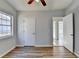 Simple bedroom with wood-look floors and window at 175 Paris Dr, Lawrenceville, GA 30043