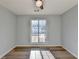 Sunny bedroom with wood-look floors and large window at 175 Paris Dr, Lawrenceville, GA 30043