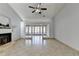 Living room with a view into a sunroom and fireplace at 175 Paris Dr, Lawrenceville, GA 30043