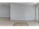 Spacious living room featuring tile flooring and a light gray wall at 175 Paris Dr, Lawrenceville, GA 30043