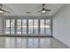 Sunroom with wall-to-wall windows and tile flooring at 175 Paris Dr, Lawrenceville, GA 30043