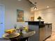 Small dining area with glass table and yellow place settings at 250 Pharr Ne Rd # 602, Atlanta, GA 30305