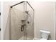 Clean bathroom with a glass shower and white toilet at 580 Grimsby Ct, Suwanee, GA 30024