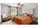 Cozy bedroom with a comfortable bed and adjacent seating area at 580 Grimsby Ct, Suwanee, GA 30024