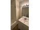 Clean bathroom with bathtub, sink, and vanity at 710 Ridge Way, Lithonia, GA 30058