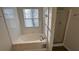 Clean bathroom with a shower and a bathtub at 710 Ridge Way, Lithonia, GA 30058