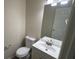 Small bathroom with toilet, sink, and vanity at 710 Ridge Way, Lithonia, GA 30058