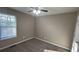 Bright bedroom with neutral walls and carpet at 710 Ridge Way, Lithonia, GA 30058