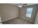 Bright bedroom with neutral walls and carpet at 710 Ridge Way, Lithonia, GA 30058