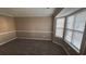 Living room with bay window and neutral wall colors at 710 Ridge Way, Lithonia, GA 30058