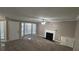 Living room with fireplace, bay window and ceiling fan at 710 Ridge Way, Lithonia, GA 30058